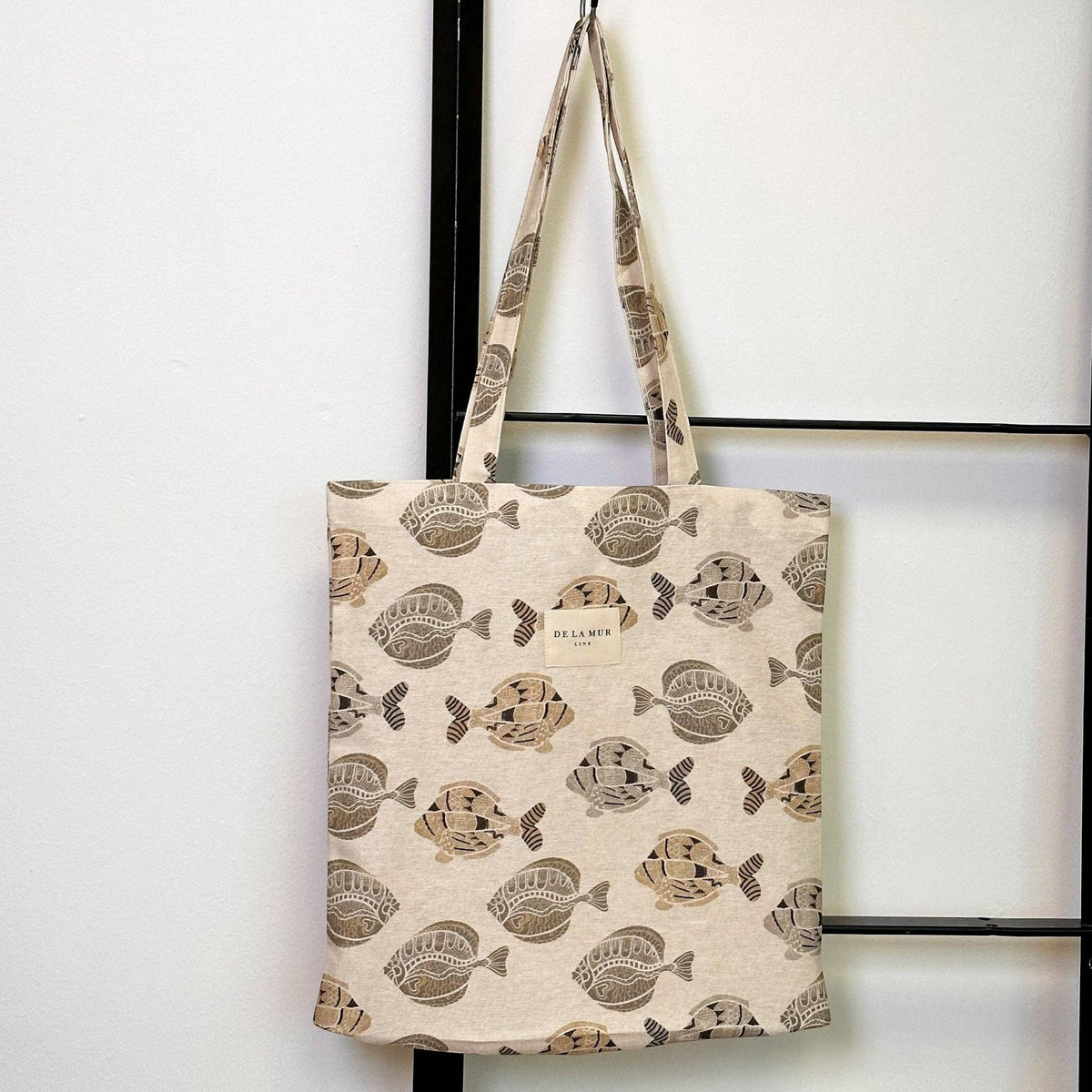 Connemara Country De La Mur Taba fabric tote bag in beige with a brown fish print and shoulder straps