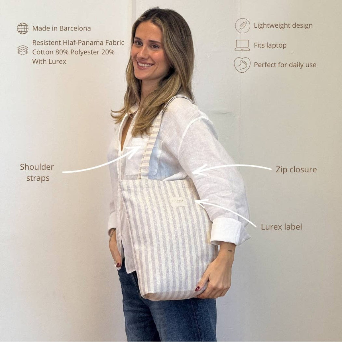Connemara Country De La Mur lilac striped tote bag with lurex, zipper closure, and shoulder straps on a woman.