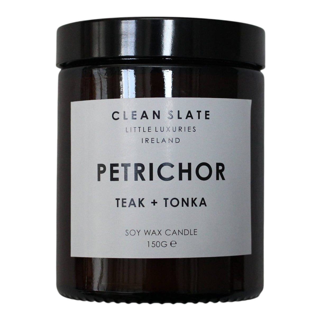 Connemara Country Clean Slate Petrichor Teak + Tonka soy wax candle in amber jar with white label.