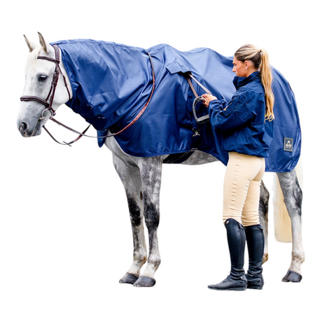 Connemara Country Mackey Pack-a-Mac navy waterproof horse rain cover with rider in a stable yard setting