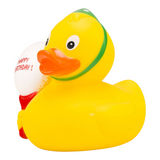 Connemara Country yellow rubber duck wearing a green party hat and holding a white Happy Birthday balloon