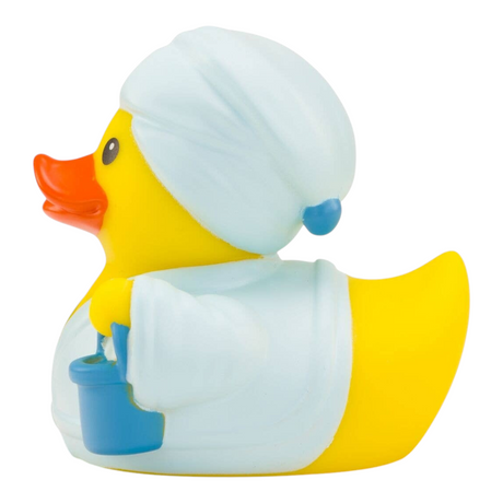 Connemara Country Antonia rubber duck wearing a white bathrobe and towel turban, holding a blue sauna bucket.