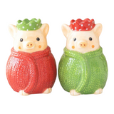 Connemara Country ceramic pig salt and pepper shakers wearing festive red and green knitted sweaters and crowns.