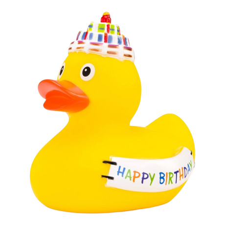 Connemara Country yellow rubber duck wearing a birthday cake hat and holding a Happy Birthday banner