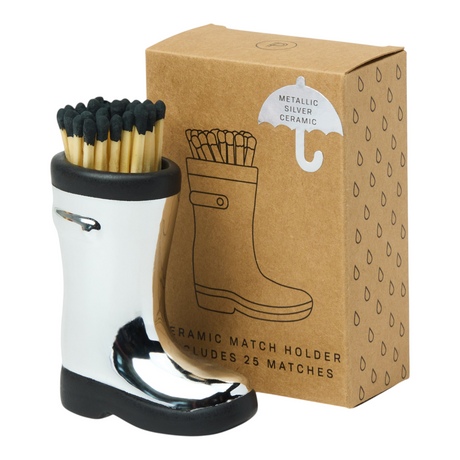 Connemara Country chrome ceramic Wellington boot match holder with 25 safety matches next to its branded gift box.