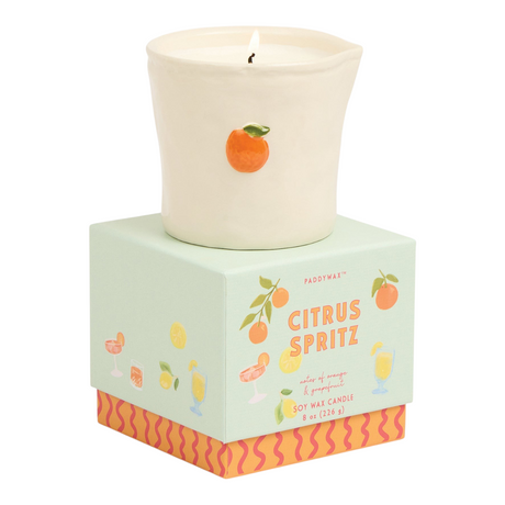 Connemara Country Paddywax Citrus Spritz candle in a cream ceramic vessel with a hand-painted orange design.
