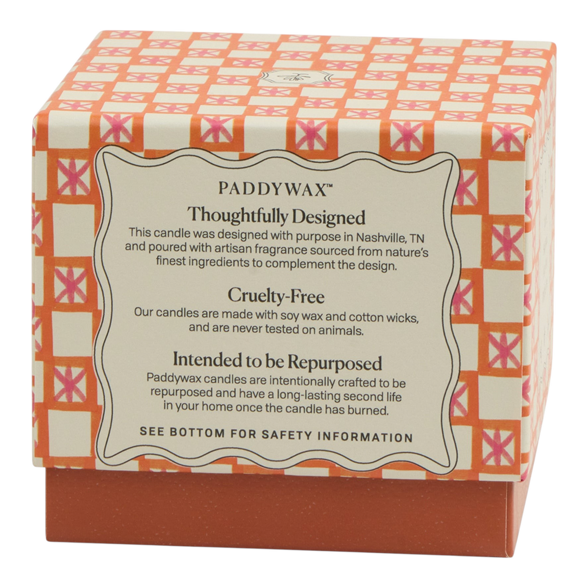 Connemara Country Paddywax candle box with pink and orange checkered pattern and product information label
