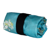 Connemara Country LOQI Almond Blossom recycled bag rolled up and secured with an elastic strap