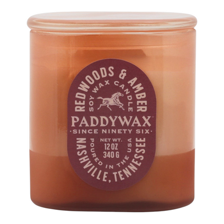 Connemara Country Paddywax Vista glass candle in rusty pink with Redwoods and Amber scent label