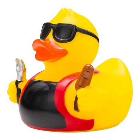 Connemara Country Ben BBQ rubber duck wearing sunglasses and a grill apron, holding a fork and sausage.