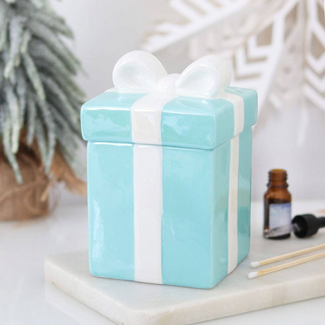Connemara Country blue ceramic Christmas present oil burner with a white bow lid for festive home fragrance