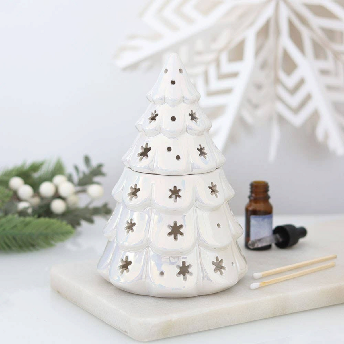 Connemara Country iridescent white fir tree oil burner with star cutouts for festive home fragrance