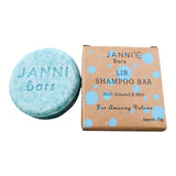 Connemara Country Janni Bars blue seaweed and mint shampoo bar with eco-friendly packaging on a pebble beach