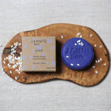 Connemara Country Janni Bars purple toning shampoo bar for blonde and grey hair with rice water on a wooden board.