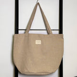 Connemara Country large sand-colored linen shopper bag with shoulder straps and De La Mur brand label.