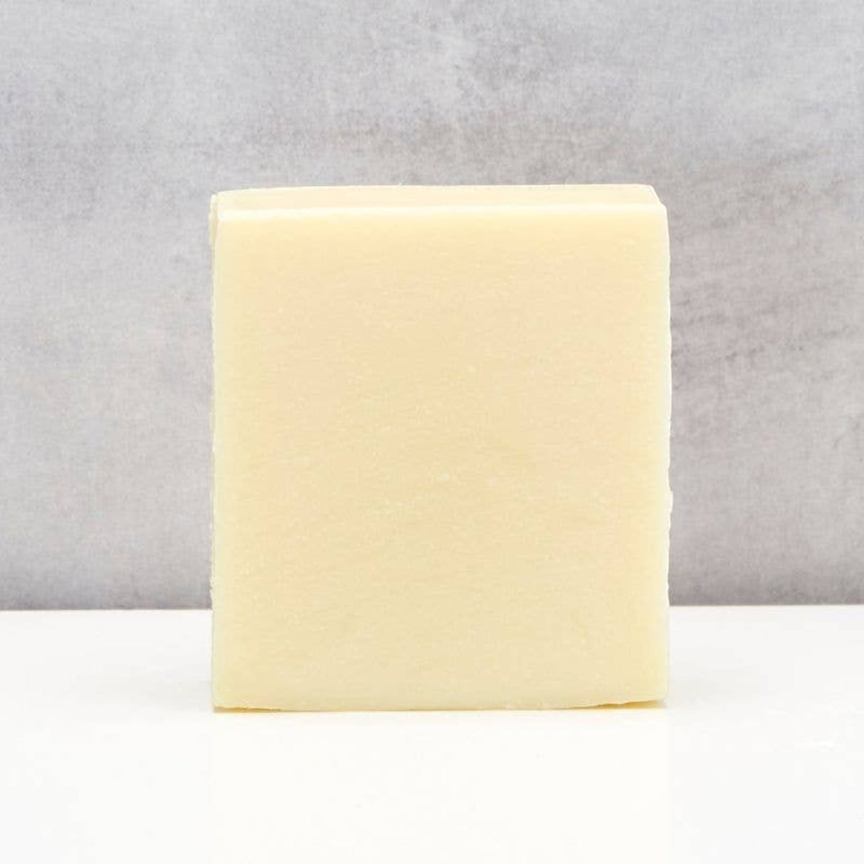 Connemara Country The Black Stuff lime and aloe vera soap bar with a smooth, pale yellow finish.
