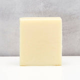 Connemara Country The Black Stuff lime and aloe vera soap bar with a smooth, pale yellow finish.