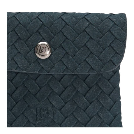 Connemara Country LOT83 Fenna 35 wallet in dark blue with a woven texture and silver logo snap button closure.