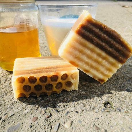 Connemara Country Janni Bars milk and honey soap with honeycomb texture, next to a glass of milk and jar of honey.