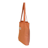 Connemara Country De La Mur orange fabric tote bag with shoulder straps and a small rectangular brand label