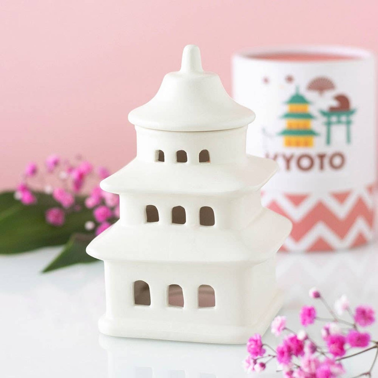 Connemara Country white ceramic pagoda oil burner and wax warmer with Kyoto themed packaging and pink floral decor.