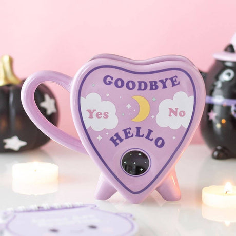 Connemara Country pastel purple ceramic planchette mug with celestial talking board design and heart-shaped handle.
