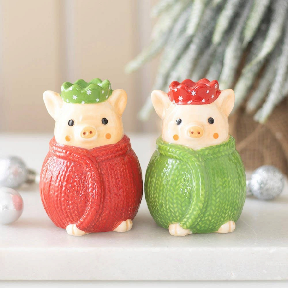 Connemara Country ceramic salt and pepper shakers shaped like pigs in red and green knitted blankets for Christmas