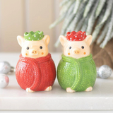 Connemara Country ceramic salt and pepper shakers shaped like pigs in red and green knitted blankets for Christmas