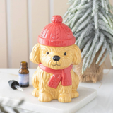 Connemara Country winter puppy ceramic oil burner wearing a red scarf and matching bobble hat lid for Christmas decor.