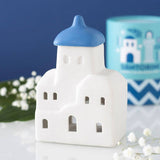 Connemara Country Santorini-themed ceramic oil burner and wax warmer with a white building and blue dome.