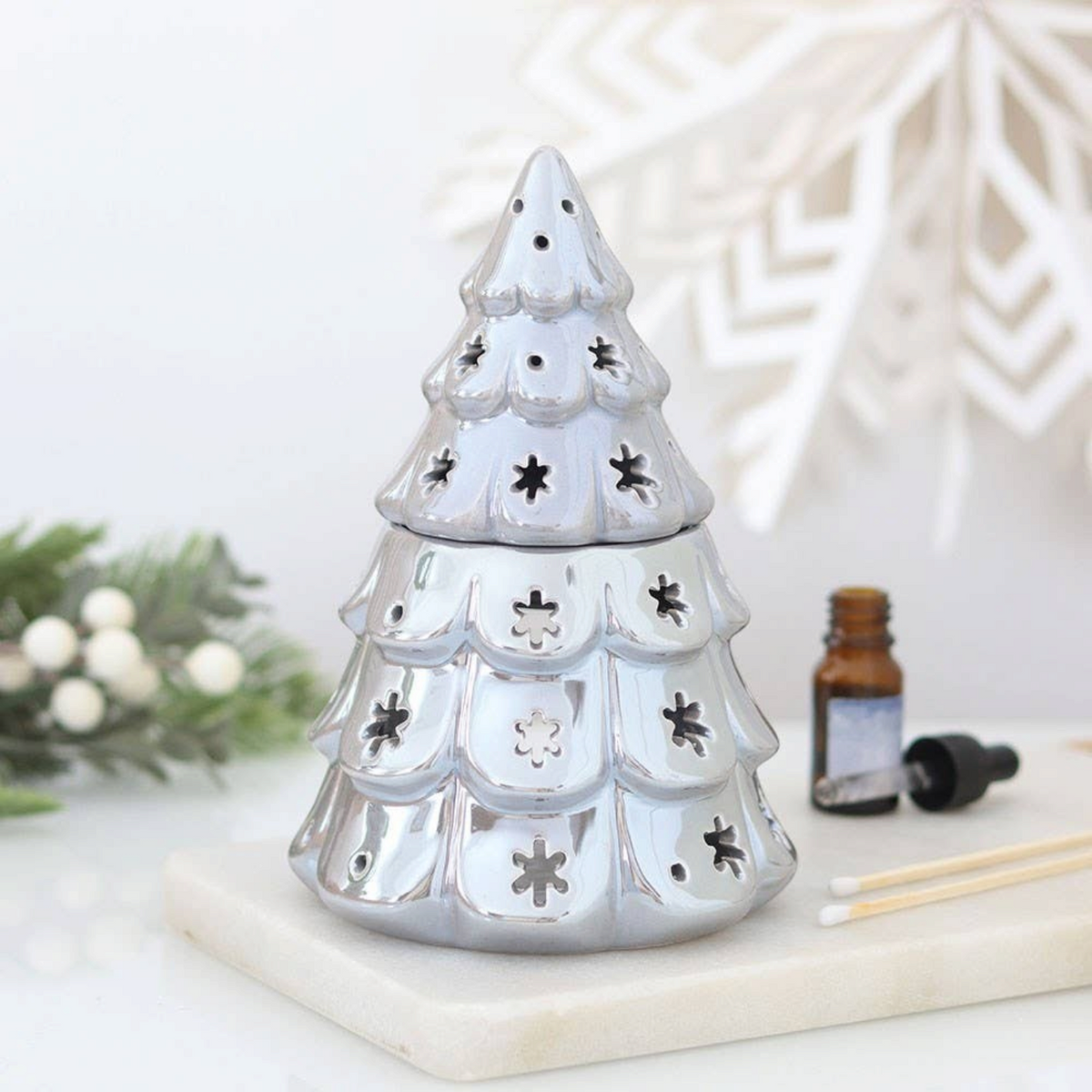 Connemara Country silver fir tree oil burner with snowflake cut-outs for festive winter home fragrance displays.