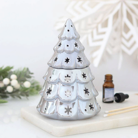 Connemara Country silver fir tree oil burner with snowflake cut-outs for festive winter home fragrance displays.