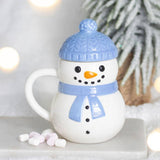 Connemara Country ceramic snowman mug with a blue bobble hat lid and matching scarf, perfect for festive hot cocoa.