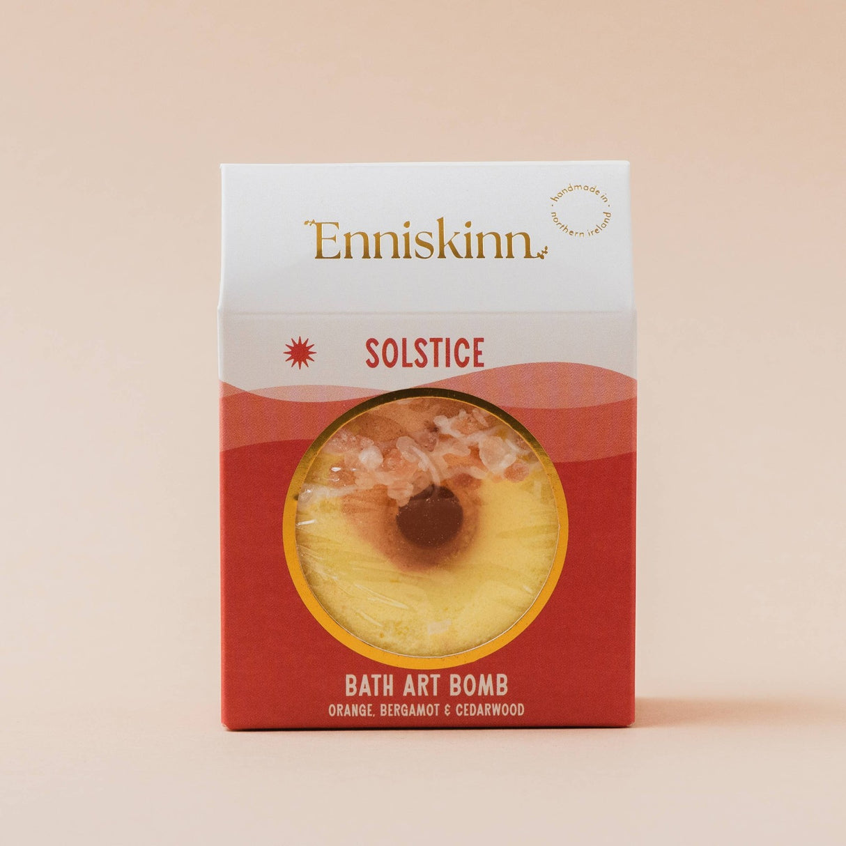 Connemara Country Enniskinn Solstice bath art bomb in orange and yellow packaging with citrus and cedarwood scent.