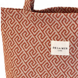 Connemara Country De La Mur small tote bag in terracotta jacquard fabric with a geometric Greek key pattern.