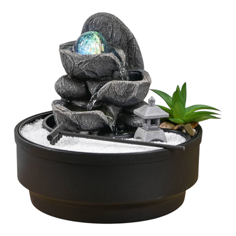 Connemara Country Bogota Zen garden indoor fountain with LED glass ball, sand, rake, and temple on a wooden table.