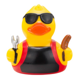 Connemara Country Ben BBQ rubber duck wearing sunglasses and a grill apron, holding a grilling fork and a sausage.